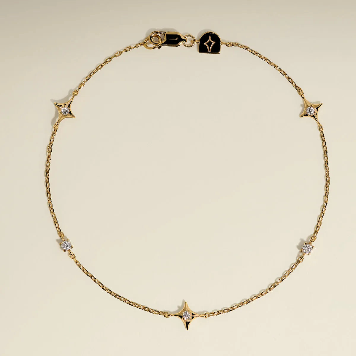 Cosmic Star Charm Bracelet in Gold