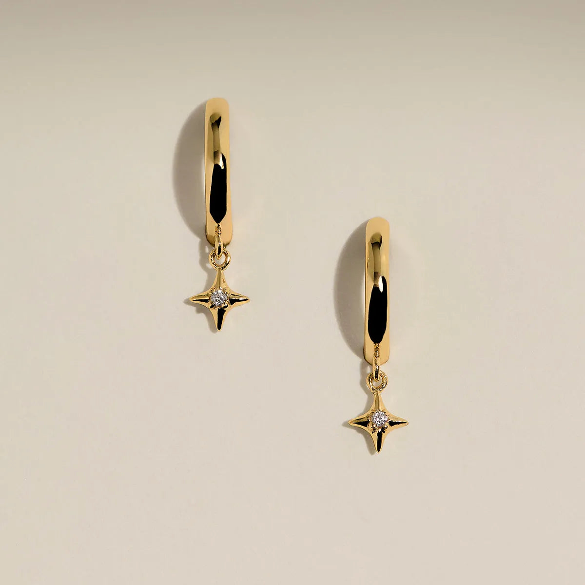 Cosmic Star Charm Huggies in Gold