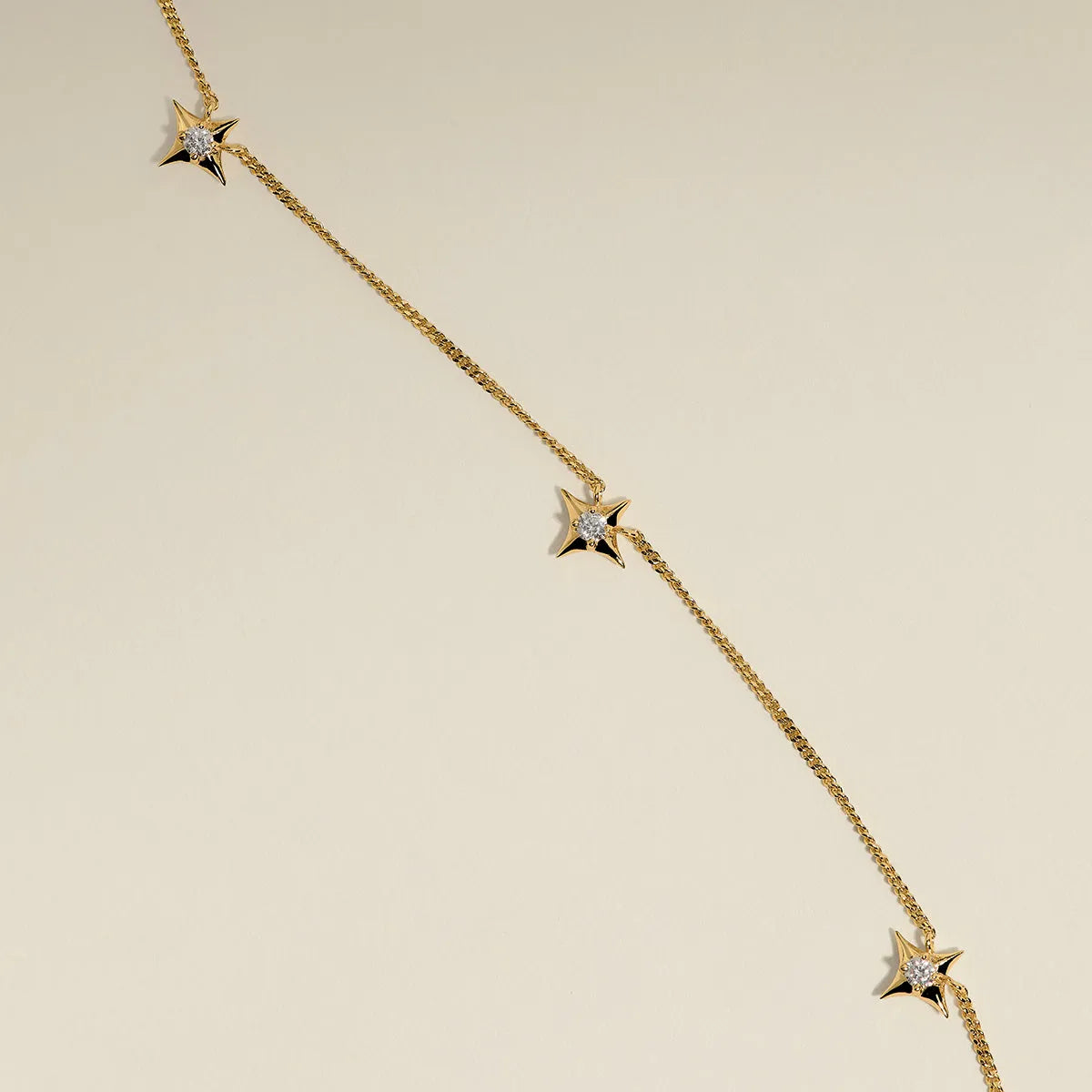 Cosmic Star Charm Necklace in Gold